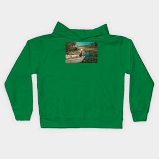 woman floating among waterlilies Kids Hoodie